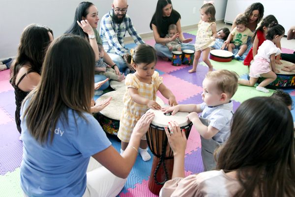 Children and caregivers making music